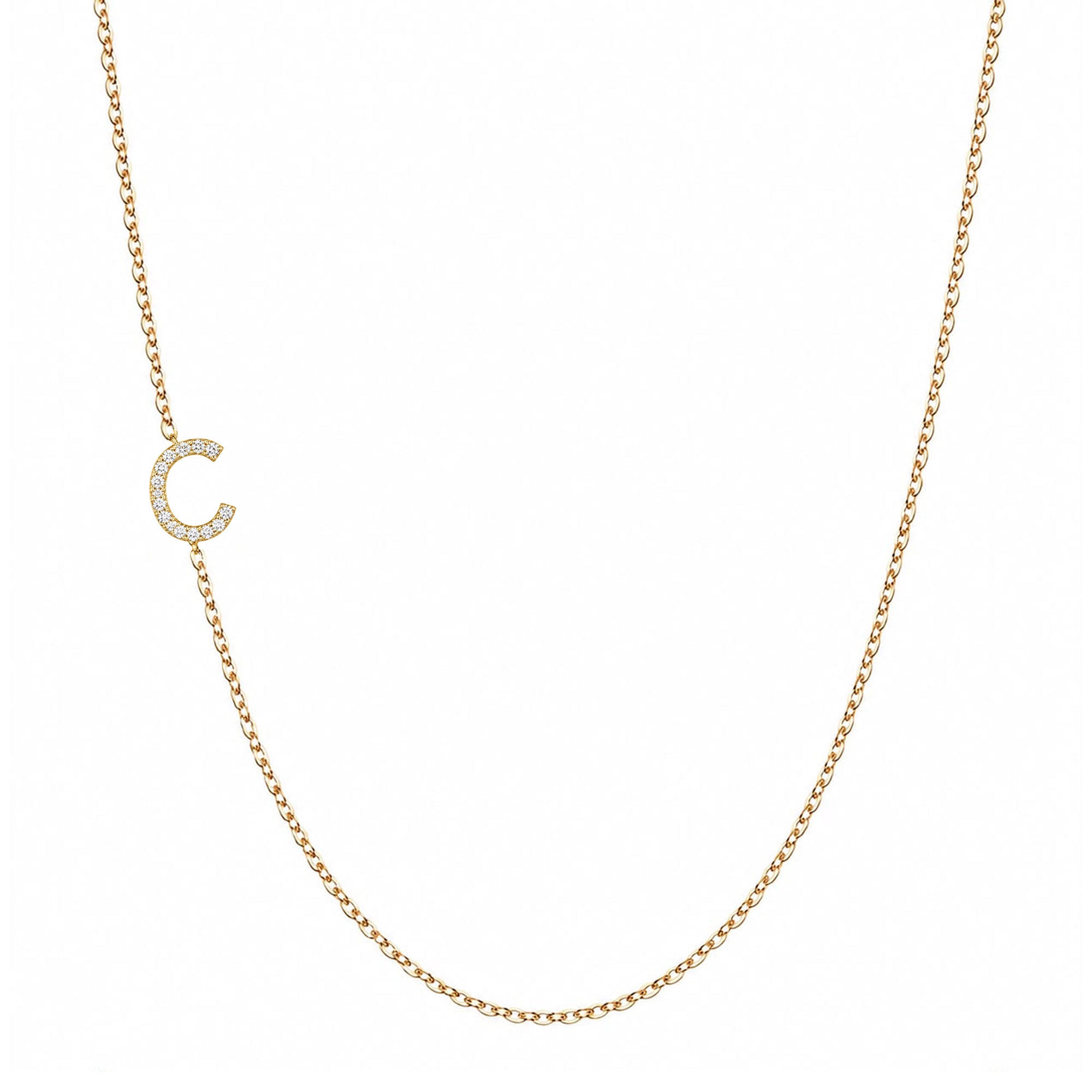 14k gold initial necklace with letter C pave diamond pendant on white background