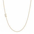 14k gold initial necklace with letter E pave diamond pendant on white background