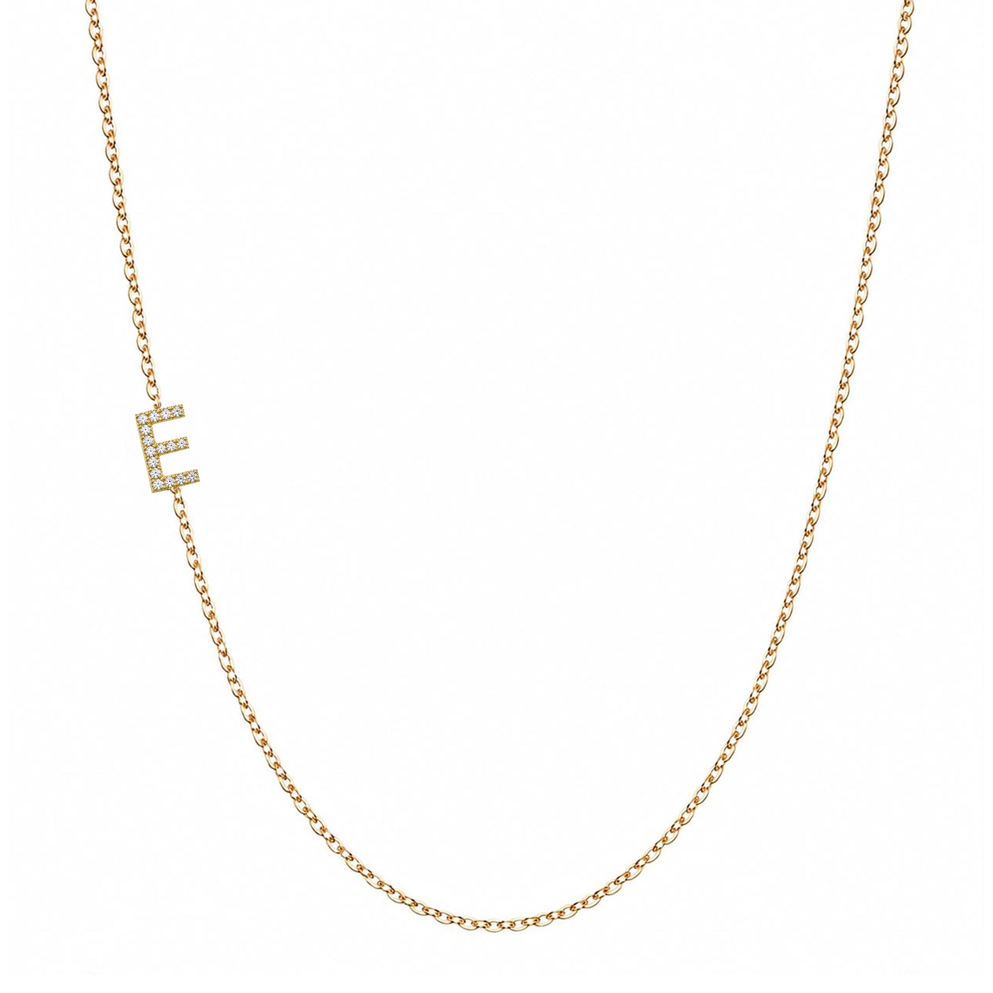14k gold initial necklace with letter E pave diamond pendant on white background