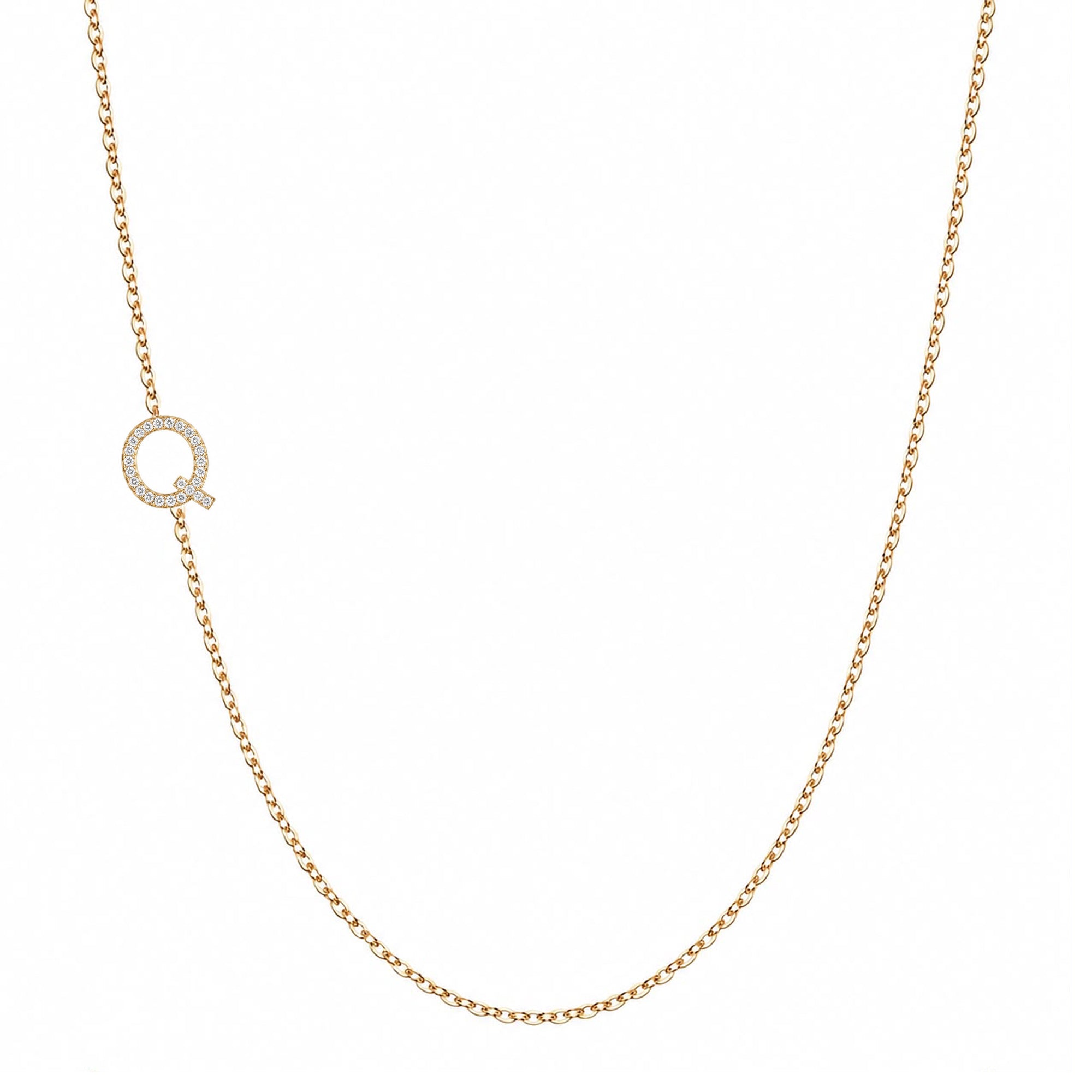 14k gold initial necklace with letter Q pave diamond pendant on white background