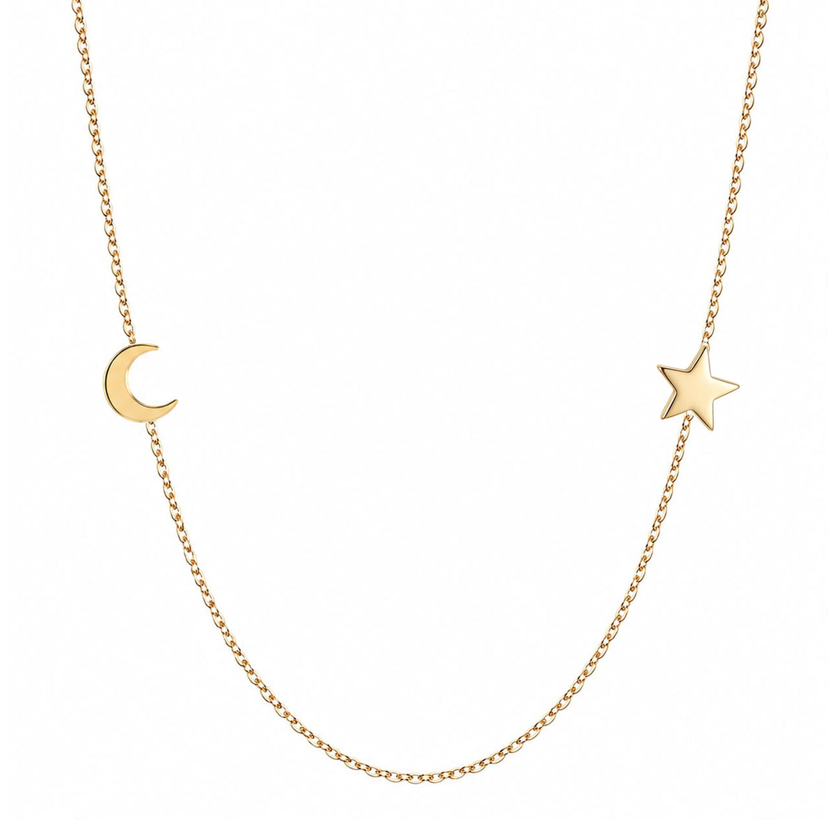 Solid 14K gold moon and star necklace on a white background