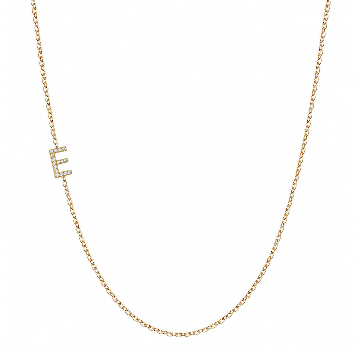 Solid 14K gold pavé diamond Letter E necklace on a white background