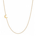 14k gold sideways moon necklace on white background