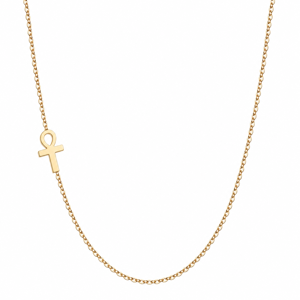 A delicate gold chain necklace featuring a small gold ankh symbol pendant, displayed against a solid white background.