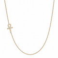 A delicate gold chain necklace featuring an ankh pendant paved with small clear stones, displayed against a solid white background.