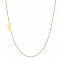 14k gold asymmetrical angel wing necklace on white background