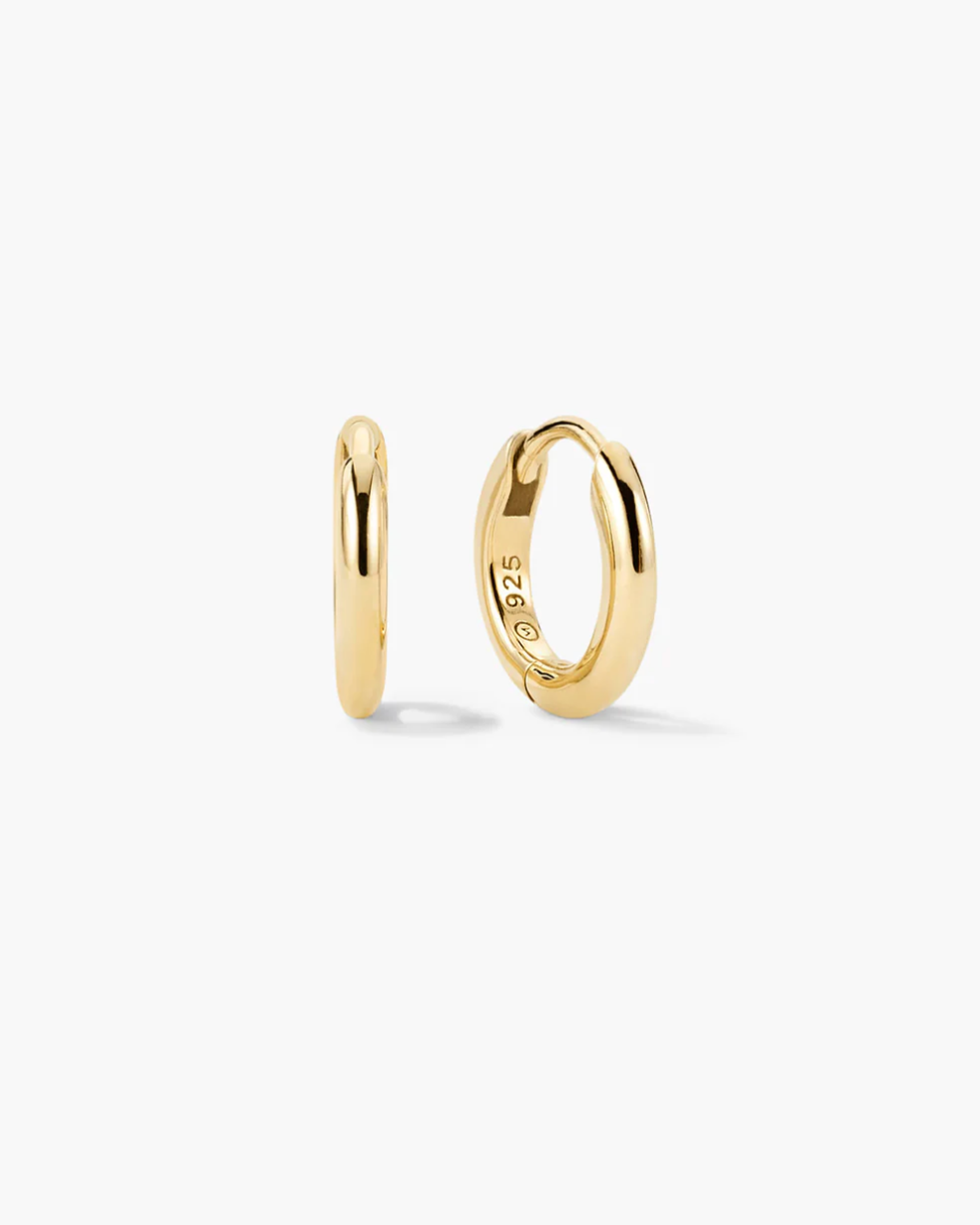 Gold hoop earrings on a white background