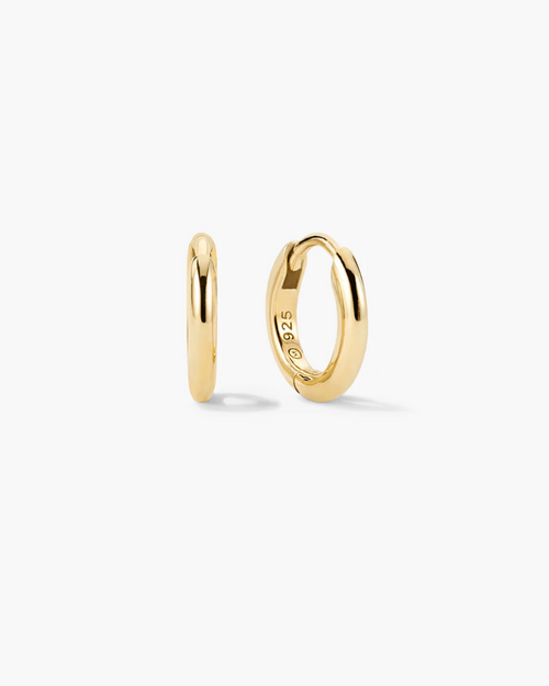 Gold hoop earrings on a white background