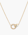 Gold necklace with a circular pendant on a white background