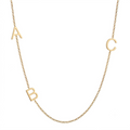 14k gold three-letter initial necklace with personalized sideways charms on white background