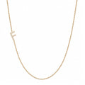 14k gold initial necklace with letter F pave diamond pendant on white background