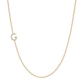 14k gold initial necklace with letter G pave diamond pendant on white background