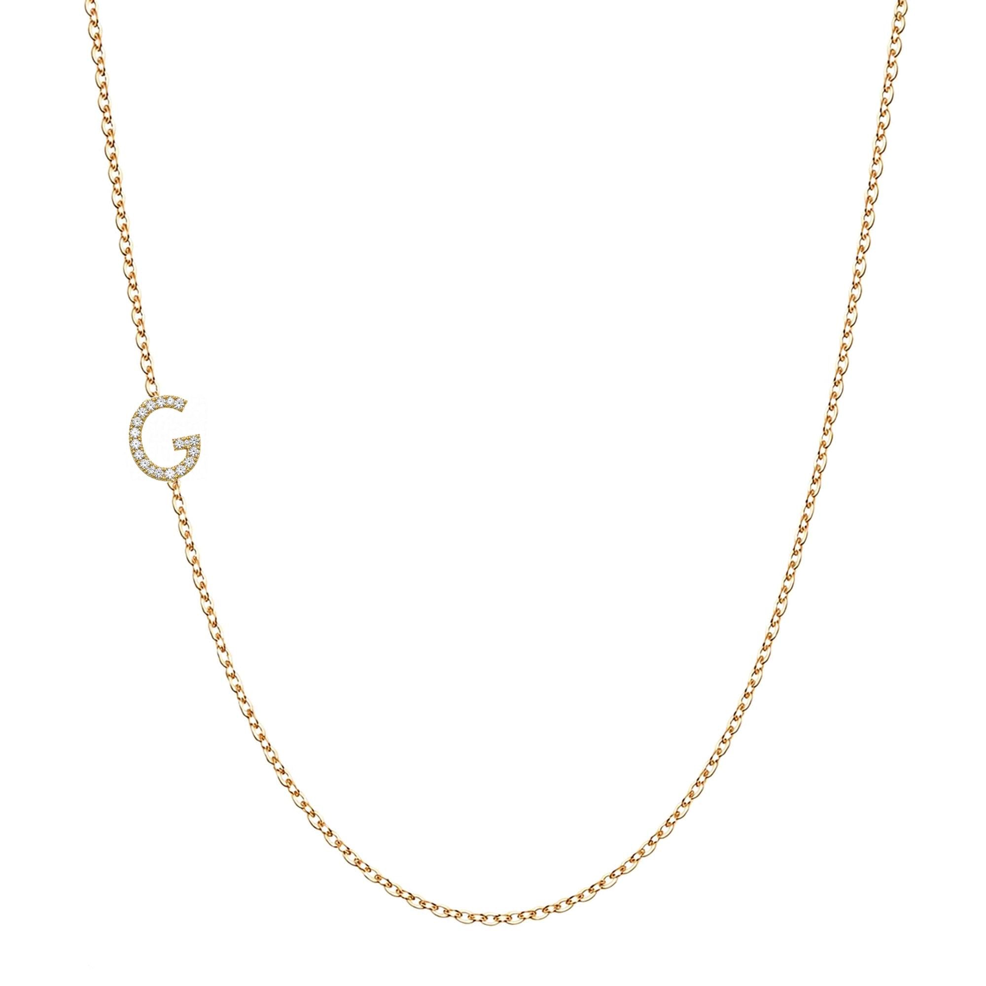 14k gold initial necklace with letter G pave diamond pendant on white background