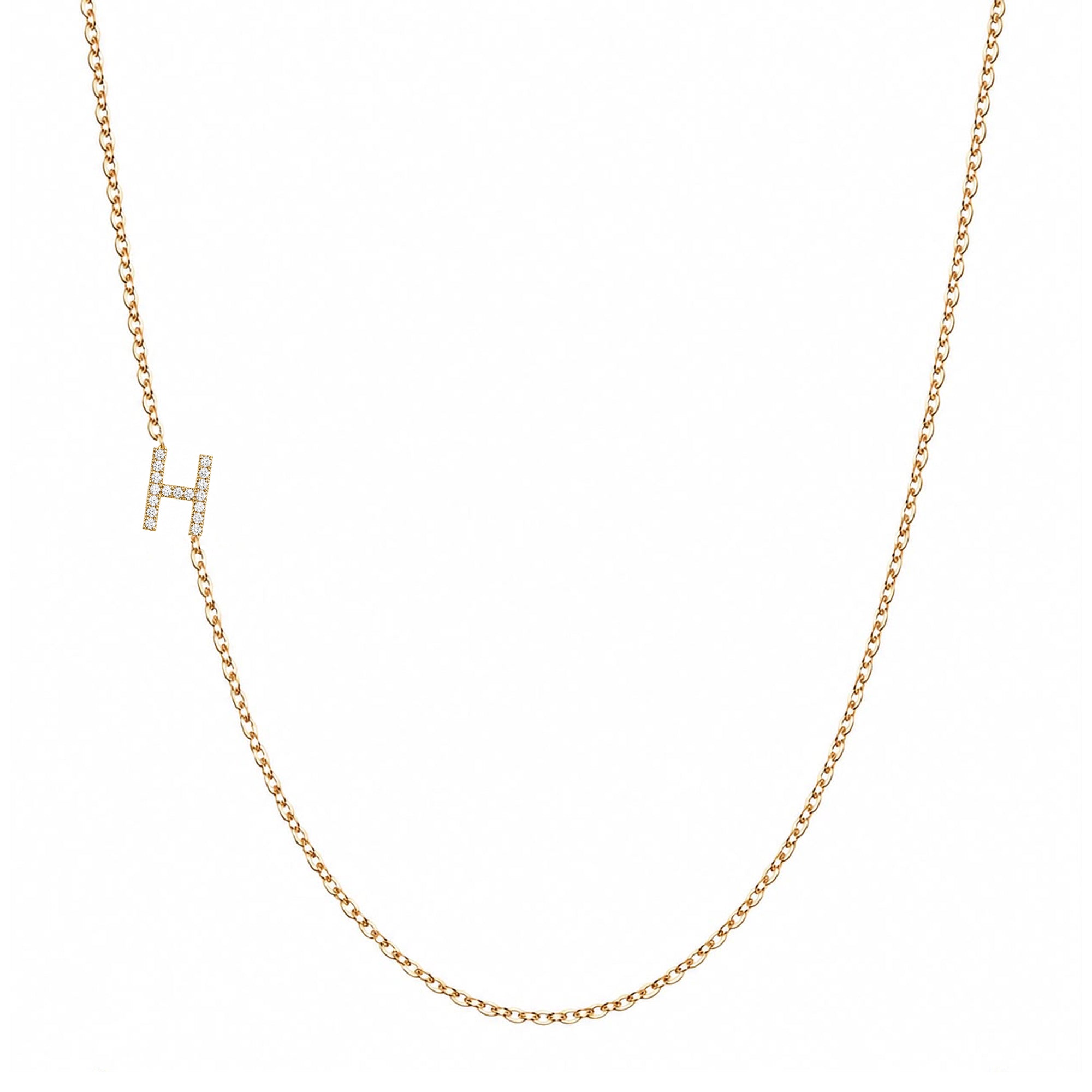 14k gold initial necklace with letter H pave diamond pendant on white background