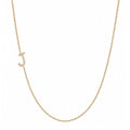 14k gold initial necklace with letter J pave diamond pendant on white background