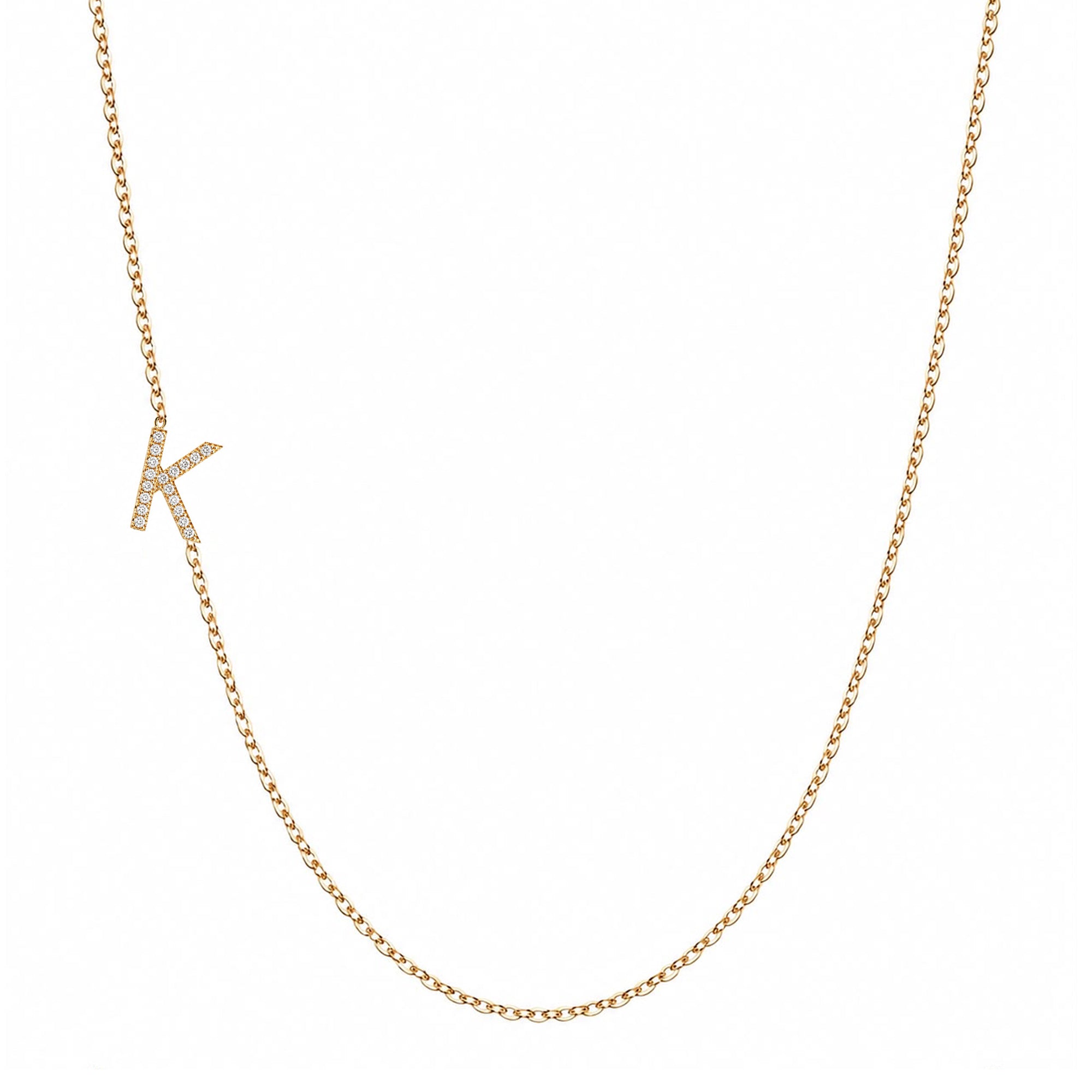 14k gold initial necklace with letter K pave diamond pendant on white background