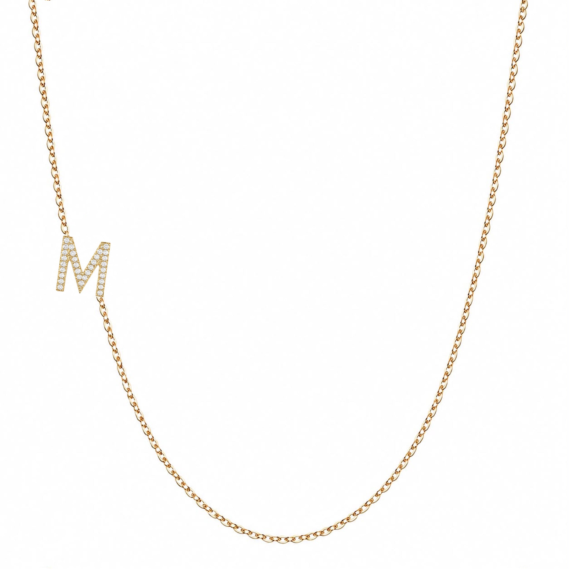 14k gold initial necklace with letter M pave diamond pendant on white background