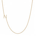 14k gold initial necklace with letter N pave diamond pendant on white background