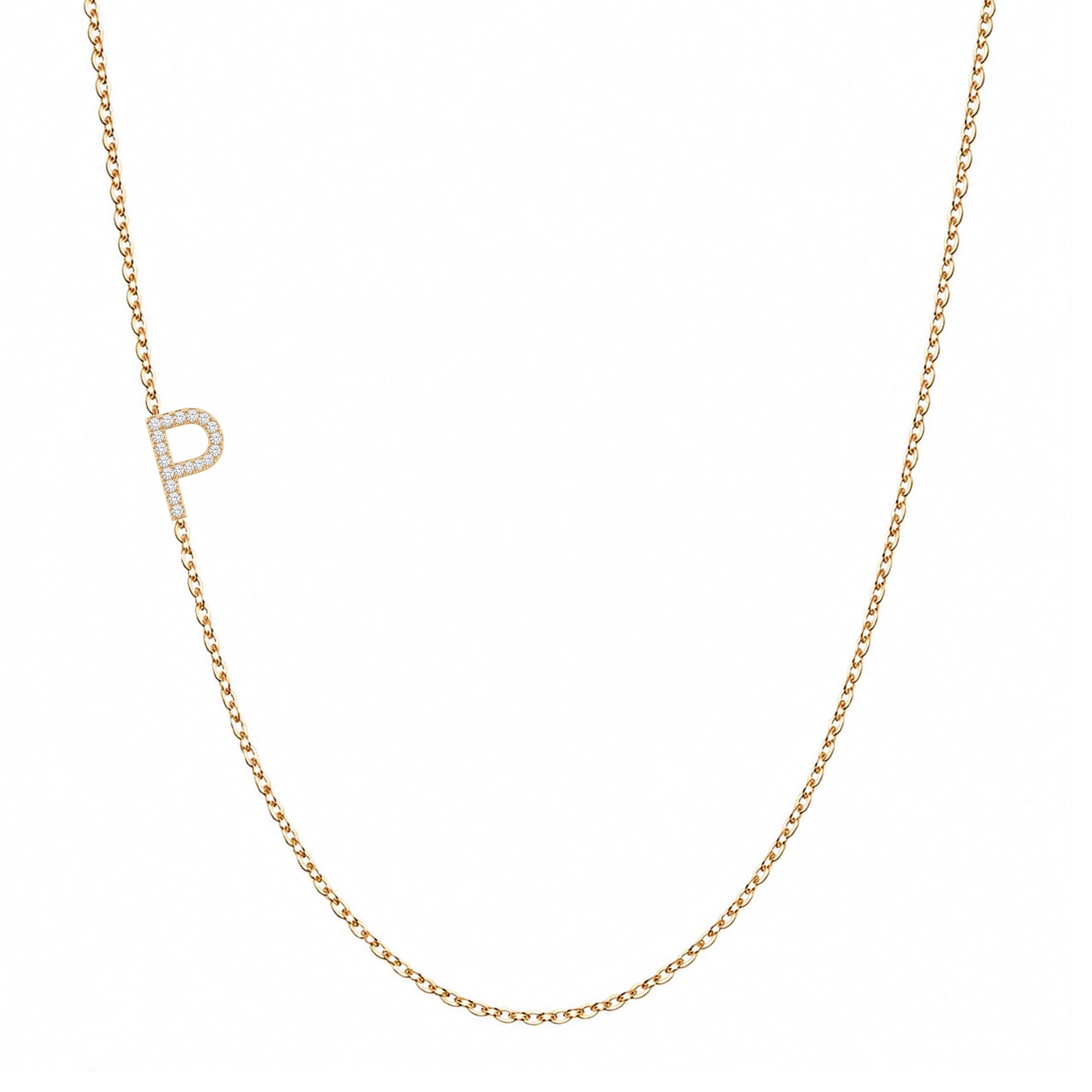 14k gold initial necklace with letter P pave diamond pendant on white background