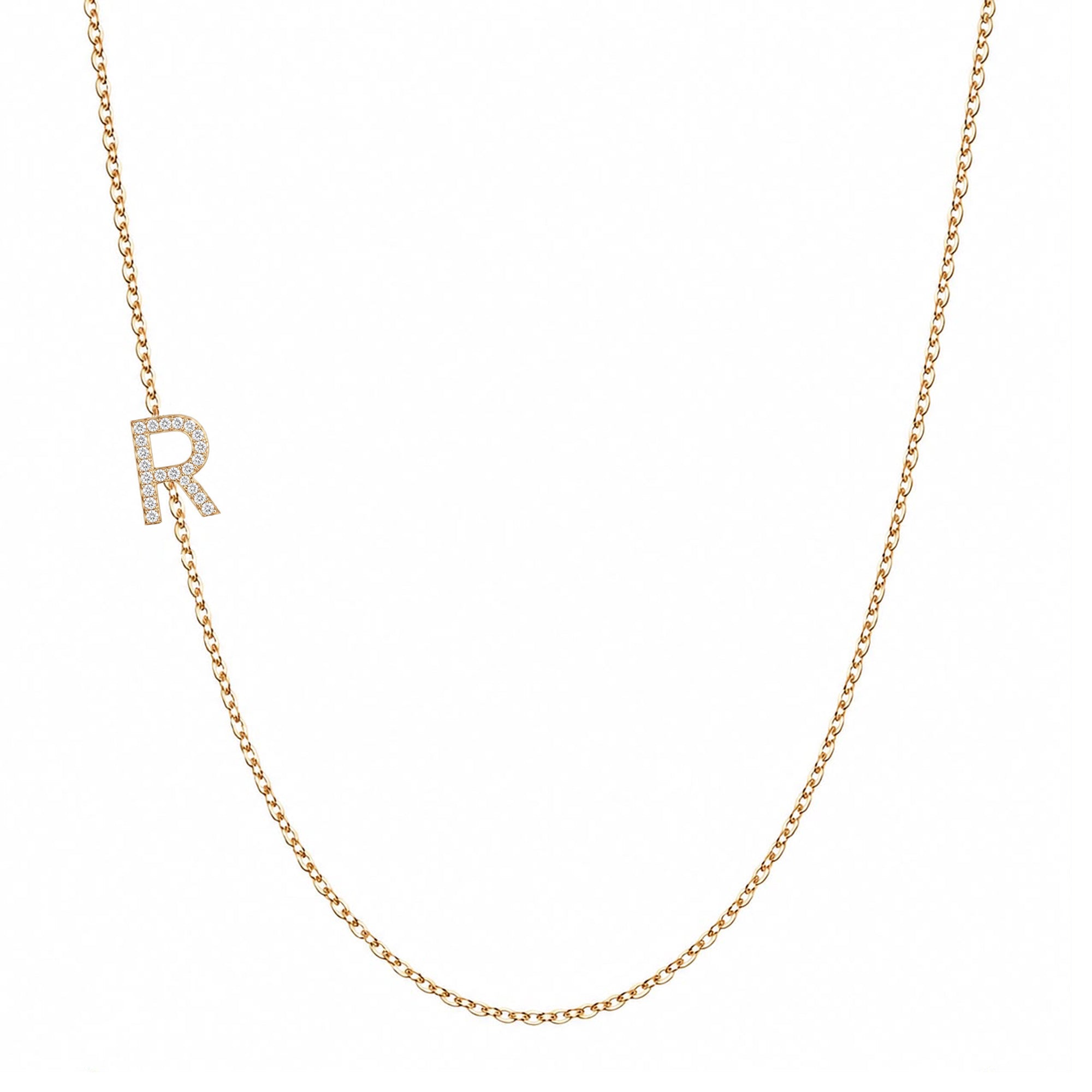 14k gold initial necklace with letter R pave diamond pendant on white background