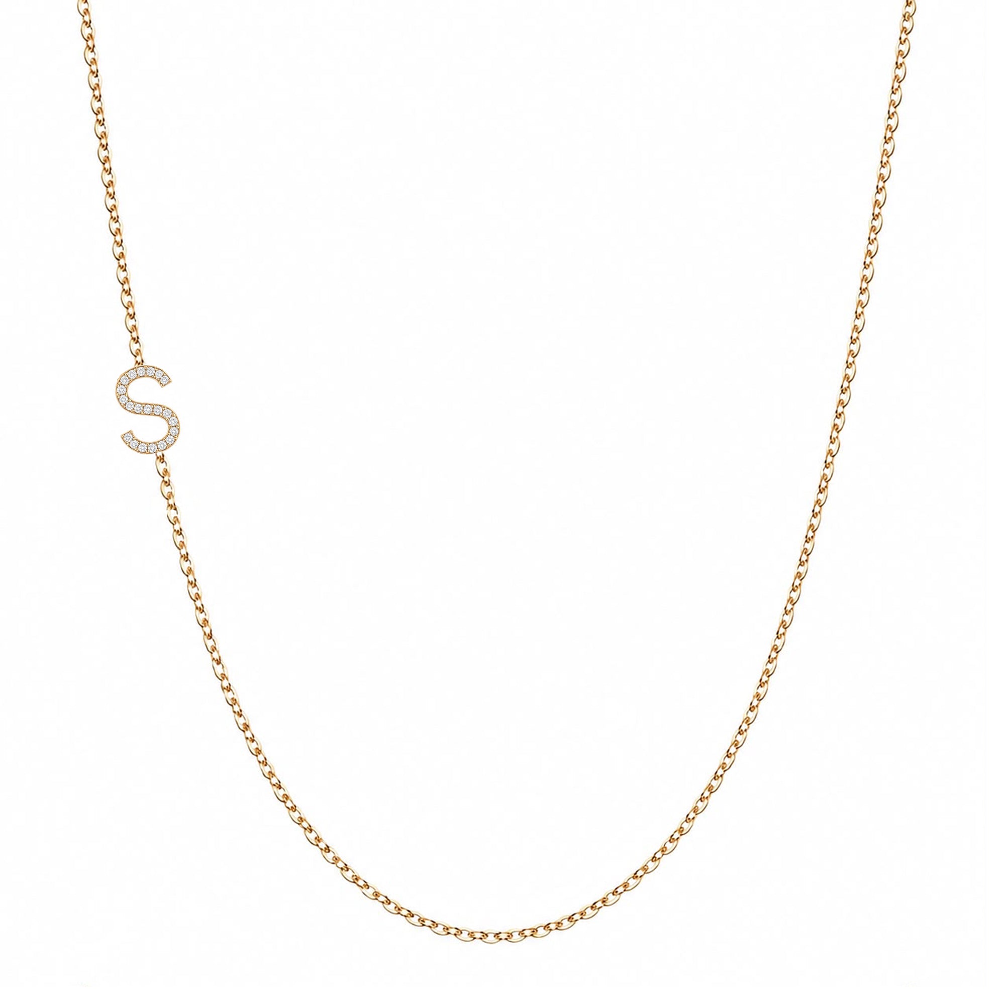 14k gold initial necklace with letter S pave diamond pendant on white background