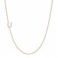 14k gold initial necklace with letter U pave diamond pendant on white background