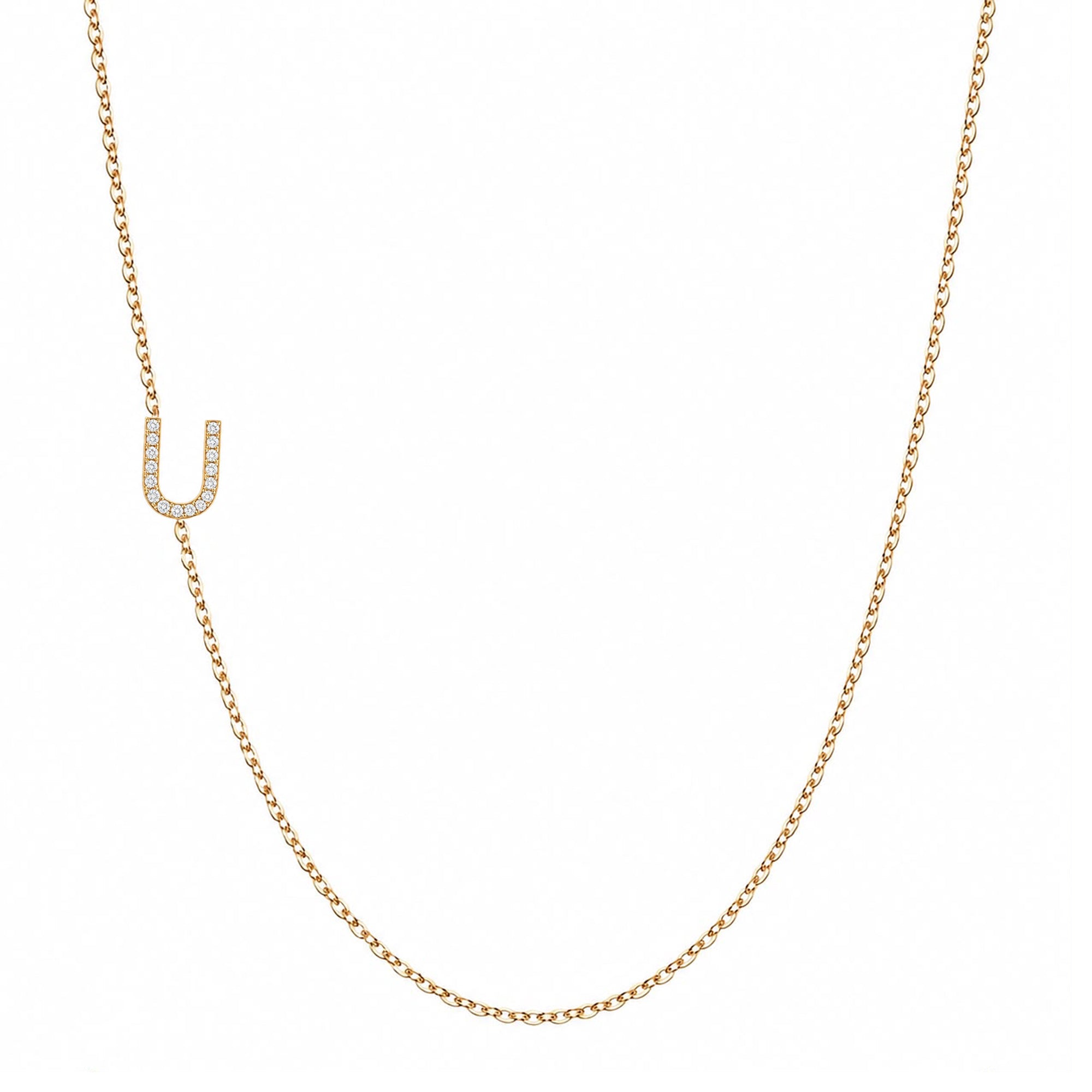 14k gold initial necklace with letter U pave diamond pendant on white background