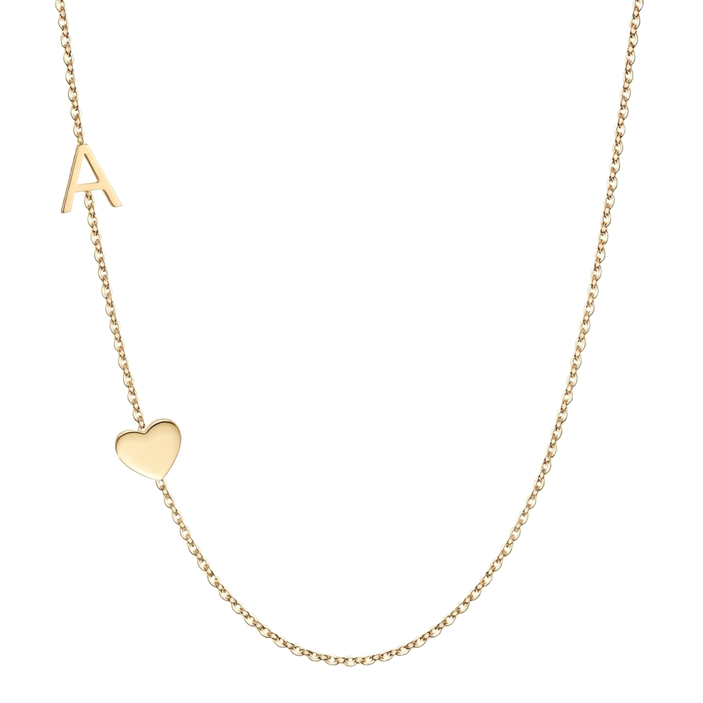 14k gold letter and heart charm necklace on white background