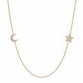 14k gold moon and star pave diamond necklace on white background