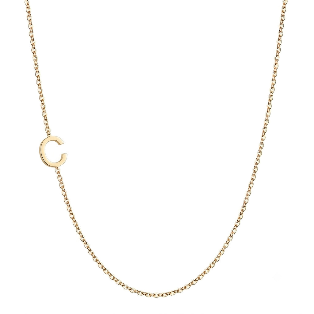 14k gold sideways initial necklace with letter C pendant on white background