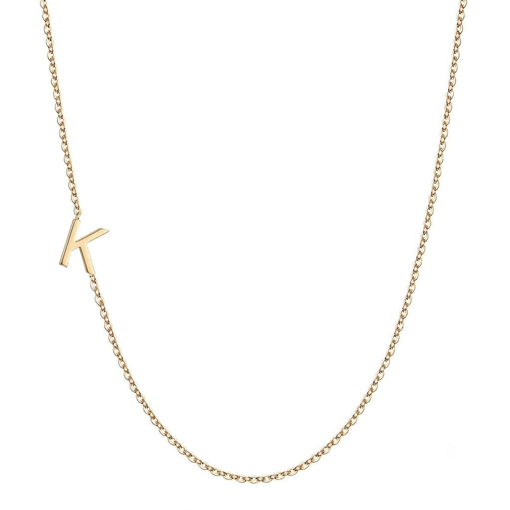 14k gold sideways initial necklace with letter K pendant on white background