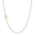 14k gold sideways initial necklace with letter N pendant on white background