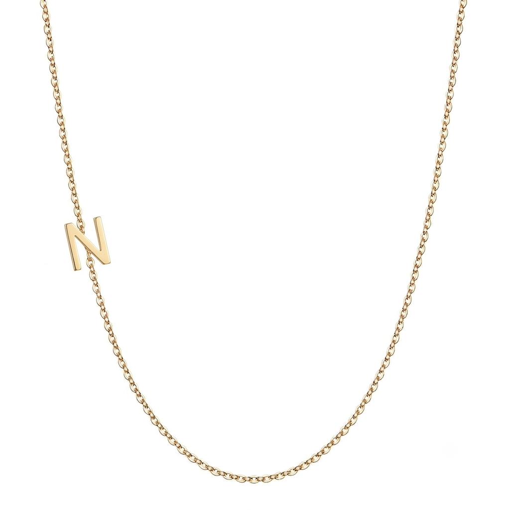 14k gold sideways initial necklace with letter N pendant on white background