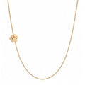 14k gold sideways paw necklace on white background