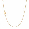 14k gold sideways star necklace on white background